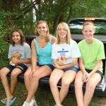 The girls riding up to the cabin.